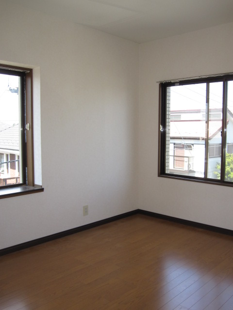 Other room space. It is bright with a large bay window