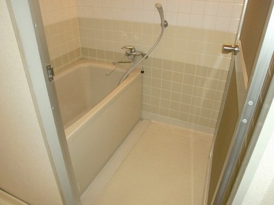 Bath. Bathroom surrounded by the muted colors of the tiles. 