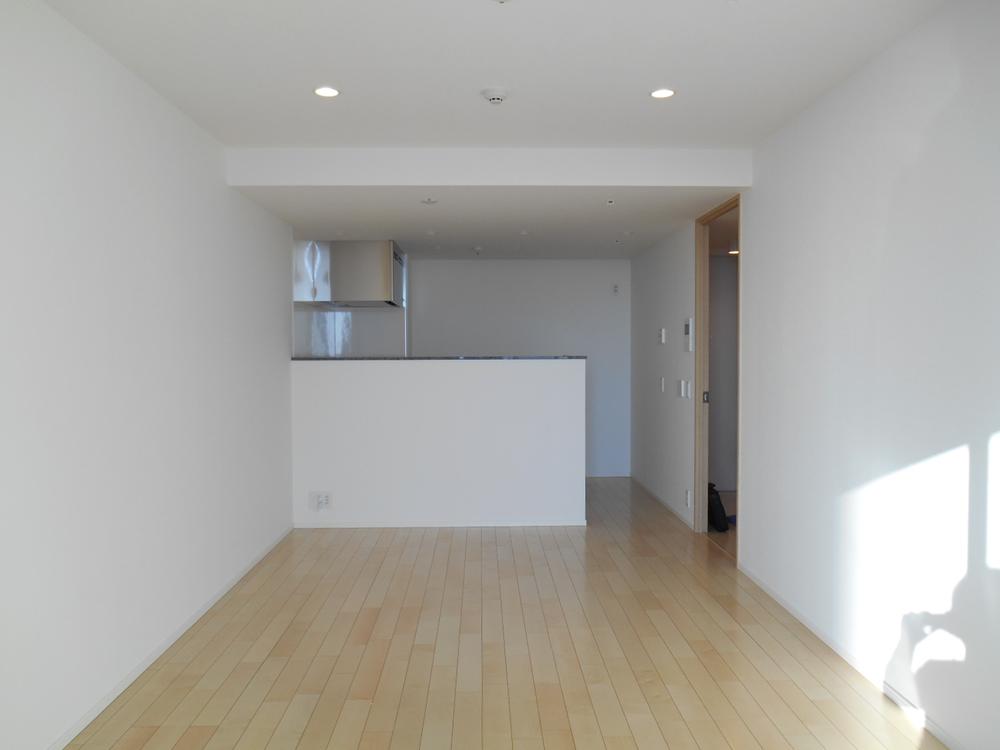 Living. Since there is no wall in the kitchen, There is a wide space