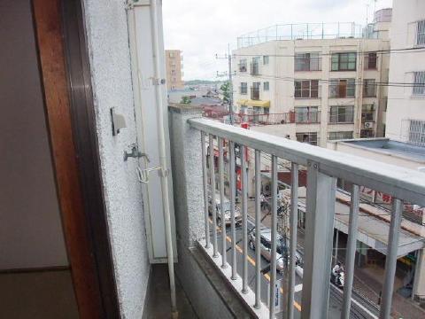 Balcony. Washing machine storage is here