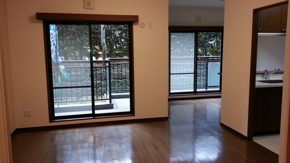 Living. Living room facing south-facing balcony