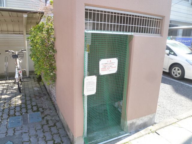 Other. There is garbage storage in the entrance side. 