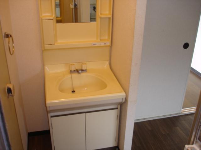 Washroom. It is convenient and also comes with wash basin.