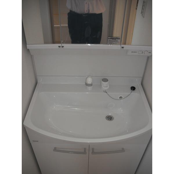 Wash basin, toilet. It is the washroom
