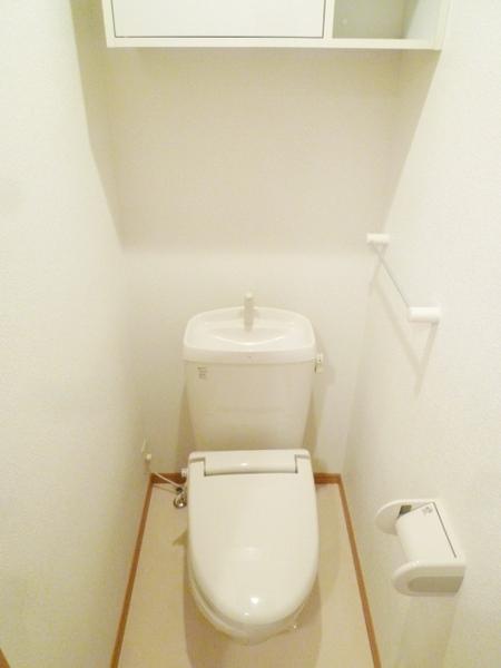 Toilet. A heated toilet seat