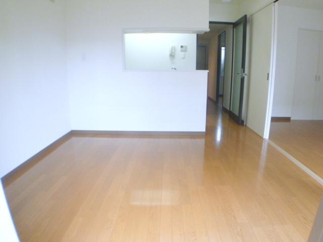 Living and room. It is decorated clean.