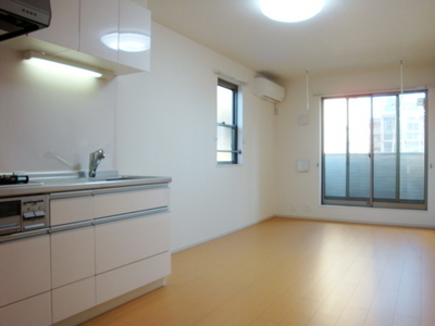 Other. Bright living room facing the balcony.