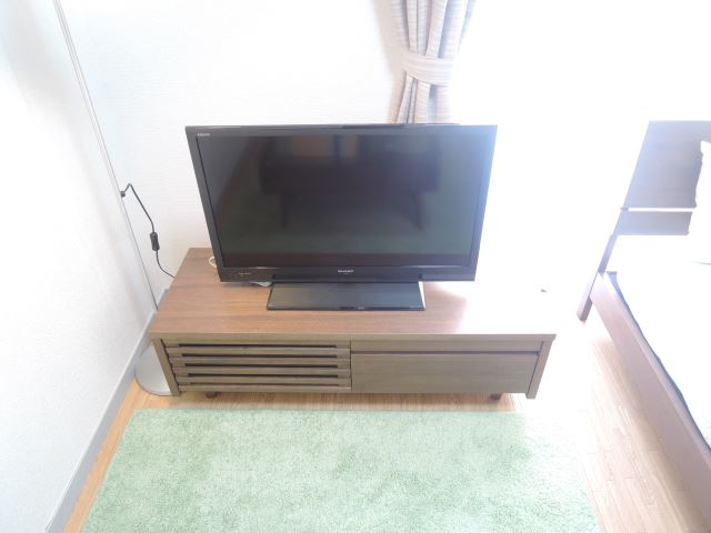 Living and room. 32-inch TV, Also it comes with a TV stand