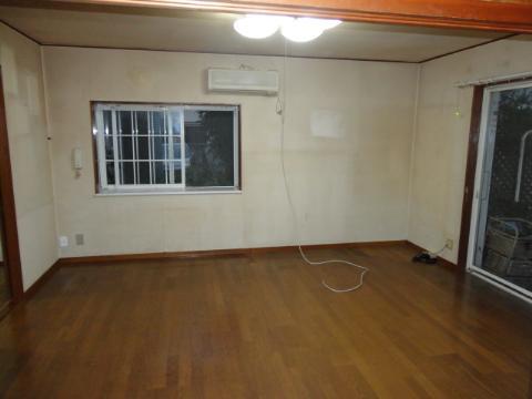 Living. The first floor living room, Cross paste replacement, Flooring overlay, And lighting exchange.