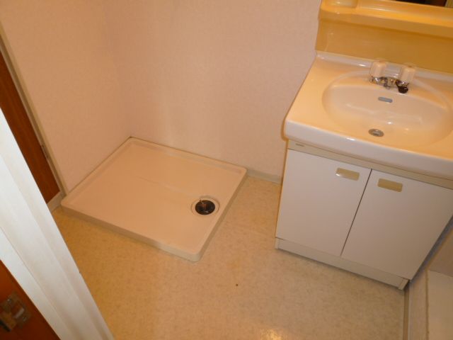 Other room space. Washing machine in the room