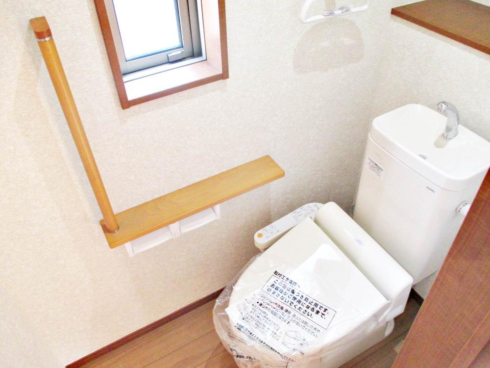 Toilet. Handrail with toilet