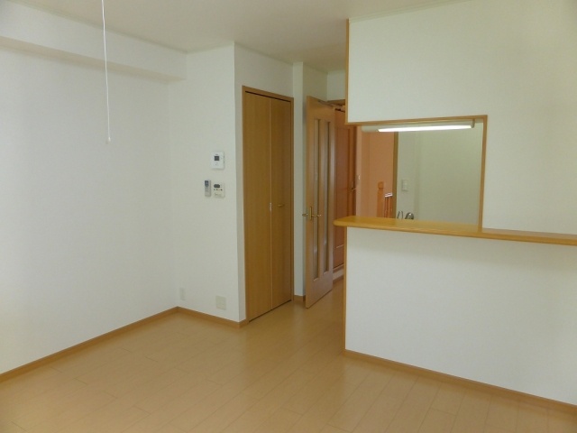 Living and room. It is a bright room.