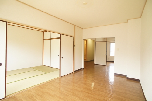 Living and room. It is a photograph of the other rooms.