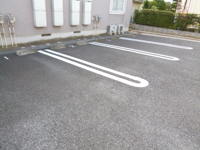 Parking lot. It is easy to park because the plane