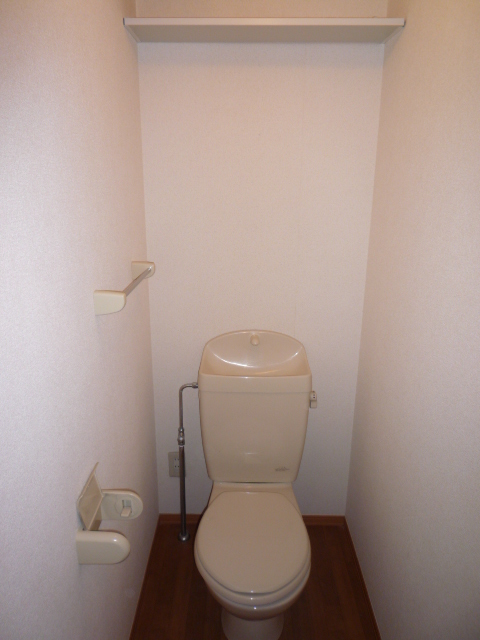 Toilet. It is a reference photograph of the same floor plan