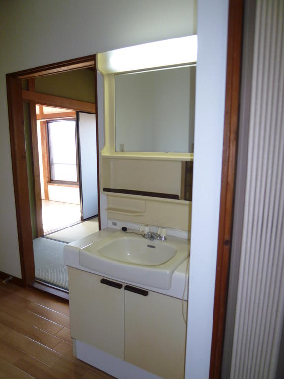 Washroom. It also saved the storage surface and there is a separate wash basin!