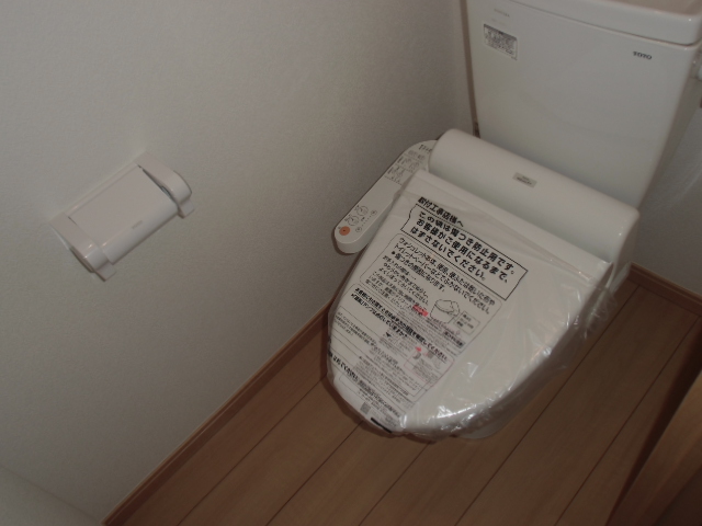 Toilet. It is equipped with a warm water washing toilet seat