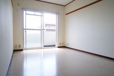 Living and room. A bright room facing the balcony