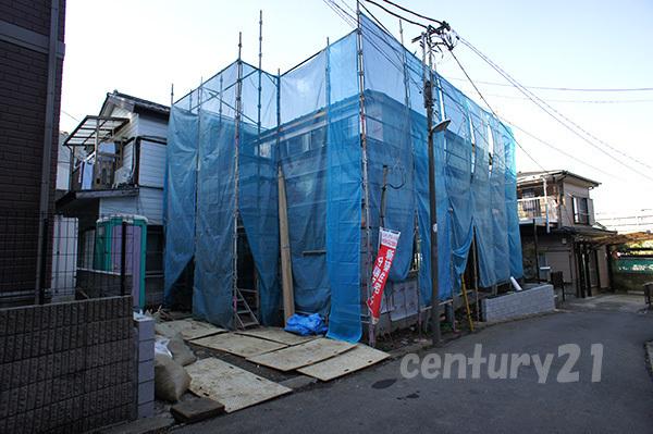 Local appearance photo. Face-to-face kitchen that can dishes while watching the children play in the living room