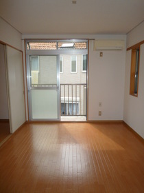 Living and room. It is a small window may be there in the corner room