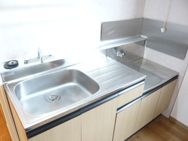 Kitchen. Bright kitchen with a side window is two-burner stove installation Allowed