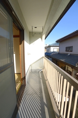 Balcony. It is a photograph of a different room (corner room).