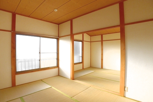 Other room space. It is a photograph of a different room (corner room).