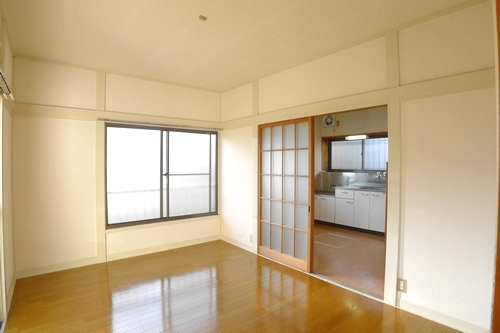 Living and room. It is a photograph of a different room (corner room).