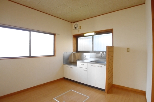 Living and room. It is a photograph of a different room (corner room).