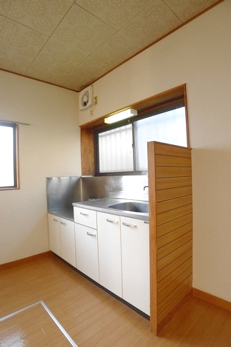 Kitchen. It is a photograph of a different room (corner room).
