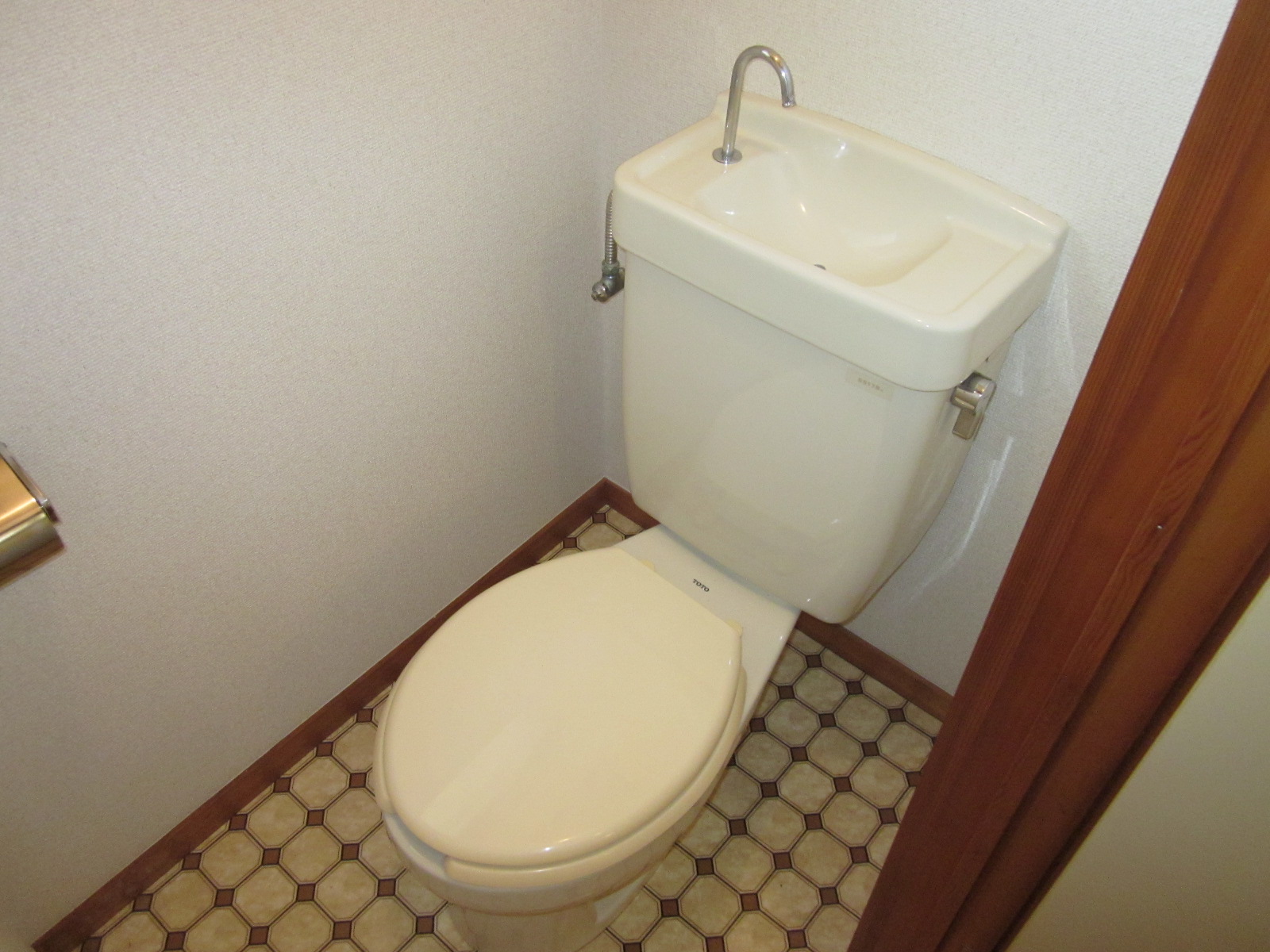 Toilet. It is a photograph of another room.