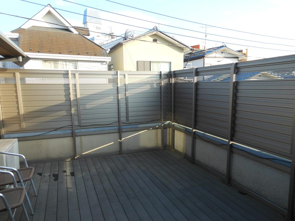 Balcony. Also Jose in peace laundry in the fence with.