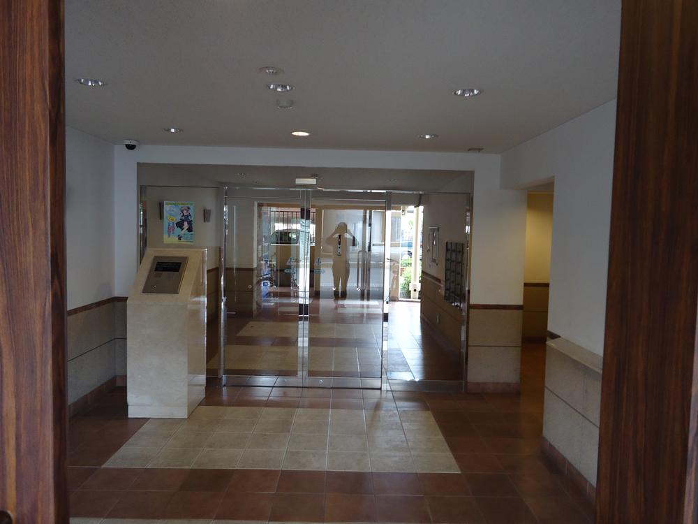 Entrance. There is auto lock and management person room, Crime prevention measures is good