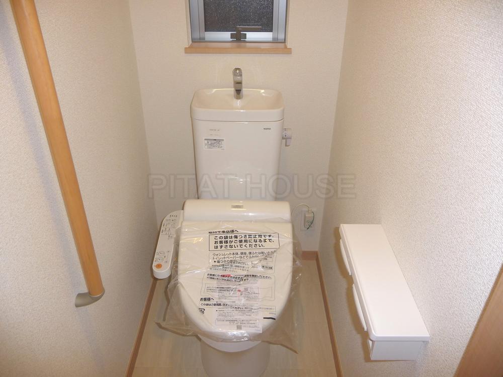 Toilet.  [toilet] Washlet toilet. Consideration to safety also with handrail.