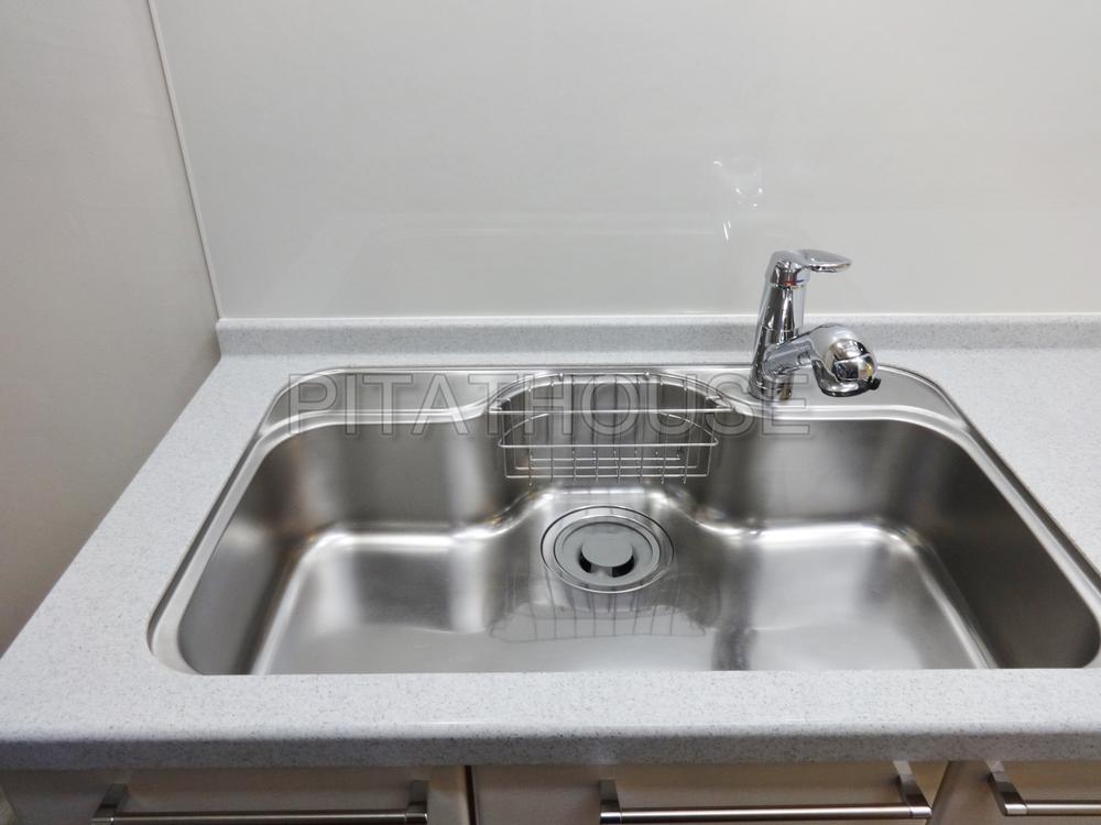 Kitchen.  [sink] Kitchen sink is easy to use by the size of the room.