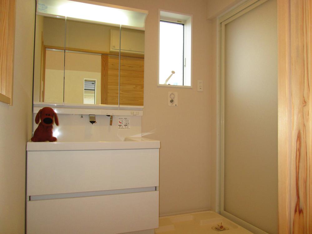 Wash basin, toilet. Here it is also a washroom that has been unified with white.