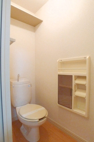 Toilet. It is a photograph of the 202 in Room