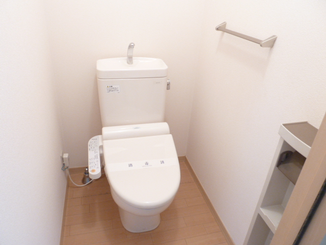 Toilet. It is with warm water washing toilet seat!