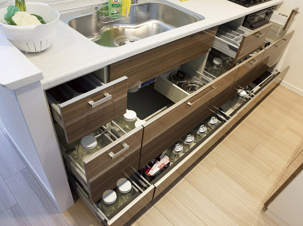 Kitchen.  [Sliding storage] Storage of system kitchens, It can be effectively utilized in the prone cabinet in a dead space, It has adopted a sliding storage. Also, Foot sliding housing that effectively utilize the dead space Ya, Adopt a spice rack, etc..