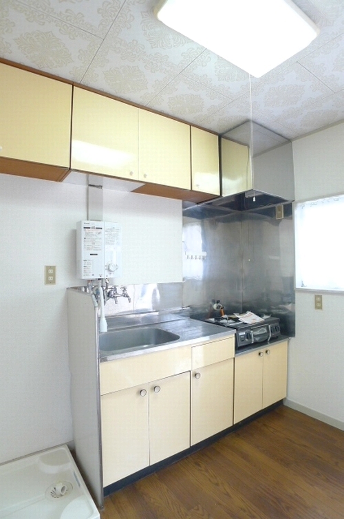 Kitchen. Another room is of image. 