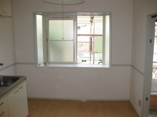 Living and room. Also there is a bay window in the kitchen.