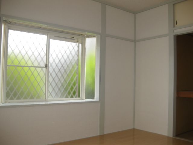 Living and room. It opens with a large bay window.
