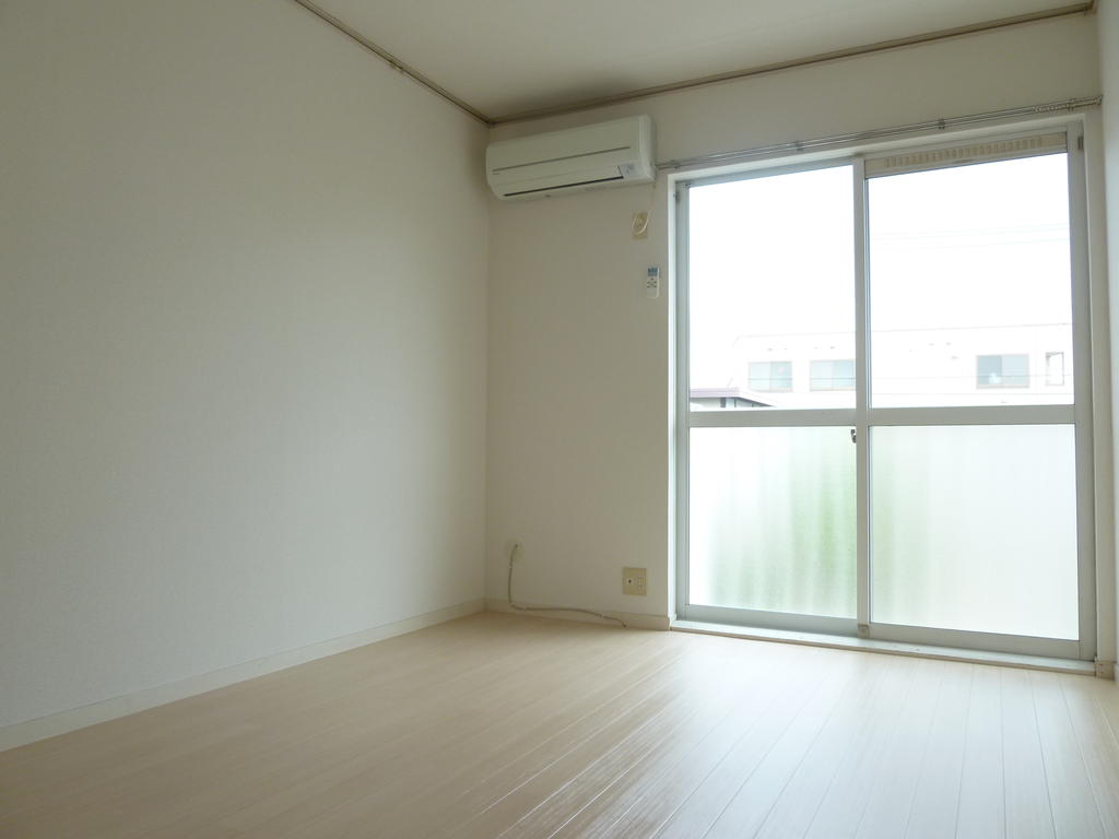 Other room space. Large windows is bright and airy.