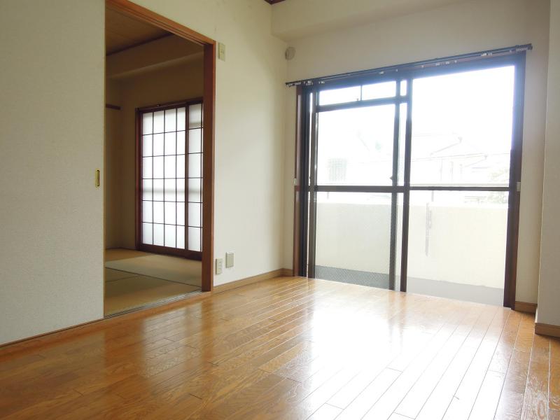 Living and room. Corner room is bright with a bay window! 