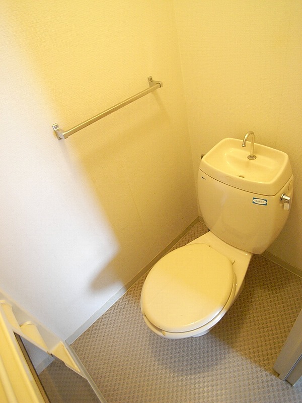 Toilet. It is separate from the bath