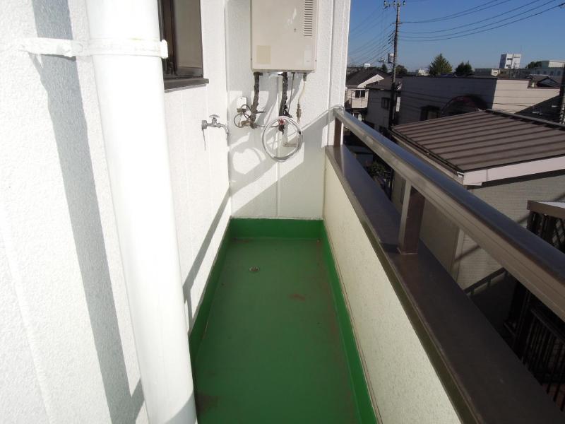 Balcony. There is a washing machine Storage