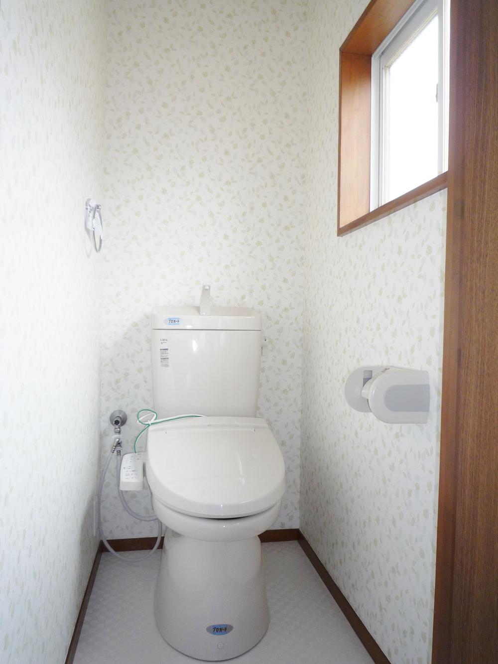 Toilet. Replaced with a new one of the hot water cleaning toilet seat with toilet