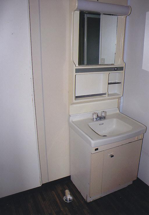 Wash basin, toilet. A little wash room of spread