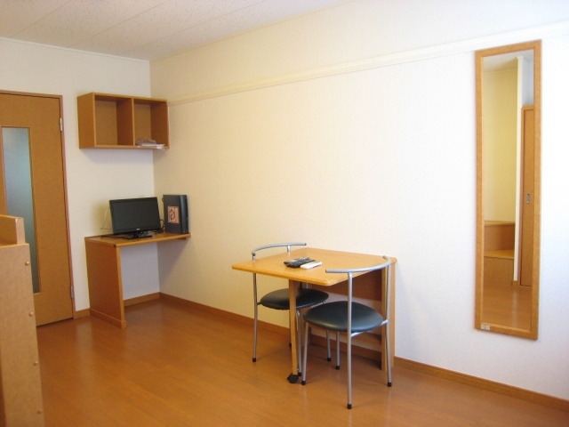 Living and room. Same type of room: desk is folded. 