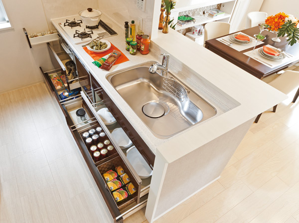 Kitchen.  [Melamine decorative plate & baseboards storage] Adopt a hard melamine decorative plate marked with dirt. Also, It established the slide storage that can be used without waste to Habaki part.